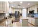Updated kitchen featuring granite countertops, stainless steel appliances, and a convenient center island at 1375 Corner Oaks Dr, Brandon, FL 33510