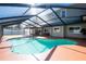 Inviting backyard pool area features an enclosed pool with plenty of patio space at 1375 Corner Oaks Dr, Brandon, FL 33510