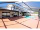 Inviting backyard pool area features an enclosed pool with plenty of patio space at 1375 Corner Oaks Dr, Brandon, FL 33510
