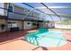 Inviting backyard pool area features an enclosed pool with plenty of patio space at 1375 Corner Oaks Dr, Brandon, FL 33510