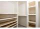 A walk-in closet that features built-in shelving and storage at 1375 Corner Oaks Dr, Brandon, FL 33510