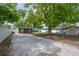 Large backyard featuring a shed, a picnic table with swing chairs and a concrete driveway at 1415 54Th N Ave, St Petersburg, FL 33703