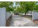 Backyard with a wooden shed, picnic table with swings, and a white privacy fence at 1415 54Th N Ave, St Petersburg, FL 33703