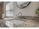 Bathroom sink with granite countertop, modern faucet, decorative plant, and natural light at 1415 54Th N Ave, St Petersburg, FL 33703
