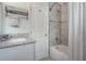 Bathroom with granite countertops, shower and tub with tiled wall at 1415 54Th N Ave, St Petersburg, FL 33703