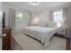 Light and airy bedroom with neutral decor, plush bedding, and natural light at 1415 54Th N Ave, St Petersburg, FL 33703