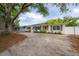 Charming single-story home with a well-maintained lawn and a white privacy fence at 1415 54Th N Ave, St Petersburg, FL 33703