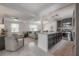 Modern kitchen with island, stainless steel appliances, and an open view to the living room at 1415 54Th N Ave, St Petersburg, FL 33703