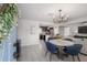 Open-concept living and dining area featuring a modern chandelier and lots of light at 1415 54Th N Ave, St Petersburg, FL 33703