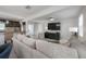 Open concept living area with modern decor, lots of light and a view to the kitchen at 1415 54Th N Ave, St Petersburg, FL 33703