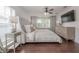 Comfortable main bedroom featuring wood-look floors, accent wall, ceiling fan and lots of natural light at 1415 54Th N Ave, St Petersburg, FL 33703
