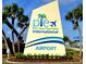 St. Pete-Clearwater International Airport sign with palm trees under a bright blue sky at 1596 Belleair Ln, Clearwater, FL 33764