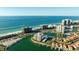 Fantastic aerial view highlighting waterfront condos, boat docks, and coastal charm at 1651 Sand Key Estates Ct # 53, Clearwater, FL 33767