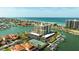 Stunning aerial view of condo building, tennis courts, and waterfront access at 1651 Sand Key Estates Ct # 53, Clearwater, FL 33767