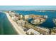 Expansive aerial view showcasing waterfront condos, beaches, and a picturesque coastal community at 1651 Sand Key Estates Ct # 53, Clearwater, FL 33767