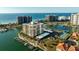 Beautiful aerial shot of beach condos and harbor offering a vibrant coastal lifestyle at 1651 Sand Key Estates Ct # 53, Clearwater, FL 33767