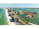 Scenic aerial view of coastal living featuring a beach, condos, and marina at 1651 Sand Key Estates Ct # 53, Clearwater, FL 33767