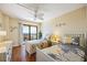 Charming bedroom featuring two twin beds, a ceiling fan, and bright decor at 1651 Sand Key Estates Ct # 53, Clearwater, FL 33767