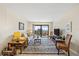 Comfortable living room with a view and large sliding glass doors to balcony at 1651 Sand Key Estates Ct # 53, Clearwater, FL 33767