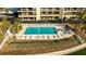 Relaxing pool area with lounge chairs offering a perfect space for waterfront enjoyment at 1651 Sand Key Estates Ct # 53, Clearwater, FL 33767