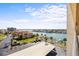 Beautiful view from the condo showcases a residential area surrounded by water at 1651 Sand Key Estates Ct # 53, Clearwater, FL 33767