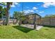 Shaded backyard gazebo on a well maintained lawn providing the perfect outdoor relaxation spot at 1661 Grove St, Clearwater, FL 33755