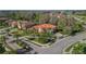 Aerial view of property with tile roof, mature landscaping, and surrounding neighborhood at 17801 Saint Lucia Isle Dr, Tampa, FL 33647