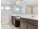 Elegant bathroom featuring a double vanity, a glass-enclosed shower, and luxurious marble flooring for a spa-like experience at 17802 Everlong Dr, Land O Lakes, FL 34638