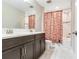 Bathroom features a double vanity and shower and tub combination with updated fixtures for enhanced comfort and convenience at 17802 Everlong Dr, Land O Lakes, FL 34638