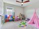 Fun bedroom with lots of room for activities and play, fostering creativity and imagination in a comfortable setting at 17802 Everlong Dr, Land O Lakes, FL 34638