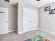 Cozy bedroom featuring neutral walls, carpet, and ample closet space, providing a comfortable retreat at 17802 Everlong Dr, Land O Lakes, FL 34638
