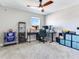 Functional bedroom with a ceiling fan, desk, and ample storage space, perfect for a home office at 17802 Everlong Dr, Land O Lakes, FL 34638