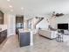 Open kitchen view to living area showing spacious countertops and modern dark wood cabinets at 17802 Everlong Dr, Land O Lakes, FL 34638