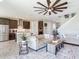 Spacious living area with views of the kitchen, featuring modern decor and comfortable sofas at 17802 Everlong Dr, Land O Lakes, FL 34638