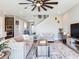 Inviting living room showing staircase, stylish furnishings, and an open layout to the kitchen at 17802 Everlong Dr, Land O Lakes, FL 34638