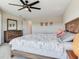 Comfortable main bedroom with wood furniture, neutral walls, and plenty of space for relaxation and personalization at 17802 Everlong Dr, Land O Lakes, FL 34638