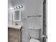 Modern bathroom with sleek vanity, illuminated mirror, and updated fixtures at 1828 Bough Ave # 3, Clearwater, FL 33760