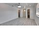 Spacious bedroom featuring wood floors, with an en-suite bathroom and walk-in closet at 1828 Bough Ave # 3, Clearwater, FL 33760