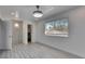 Second bedroom with an ensuite bathroom and large windows providing natural light at 1828 Bough Ave # 3, Clearwater, FL 33760