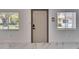 Clean entryway featuring tile flooring and a modern front door with windows letting in natural light at 1828 Bough Ave # 3, Clearwater, FL 33760