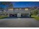 Two-story condominium complex with open carports and lush landscaping at 1828 Bough Ave # 3, Clearwater, FL 33760