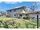 Beautiful exterior of condo with a lush green lawn, vibrant landscaping, and a welcoming front entrance at 1828 Bough Ave # 3, Clearwater, FL 33760