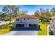 Charming two-story home with covered parking, beautiful landscaping, and a welcoming front porch at 1828 Bough Ave # 3, Clearwater, FL 33760