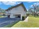 Residential exterior showcasing carports, well-maintained landscaping, and a clean design at 1828 Bough Ave # 3, Clearwater, FL 33760