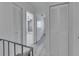 Hallway with white trim, wood flooring, and closet space, offering ample storage at 1828 Bough Ave # 3, Clearwater, FL 33760
