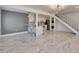 Bright open living room and kitchen with modern finishes and marble tile flooring throughout at 1828 Bough Ave # 3, Clearwater, FL 33760