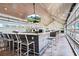 Stylish bar area with flat screen TV and ample seating at 19469 Autumn Oak Ln, Brooksville, FL 34601