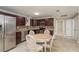 Bright kitchen with stainless steel appliances, granite countertops, and a stylish mosaic backsplash at 2005 Harvard Ave, Dunedin, FL 34698