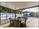 Outdoor patio features comfortable wicker seating and views of the pool area at 2005 Harvard Ave, Dunedin, FL 34698