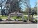 The community sign for Brigadoon of Clearwater with lush landscaping creating a warm invitation at 202 Brigadoon Dr, Clearwater, FL 33759